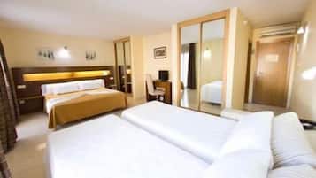 Minibar, desk, blackout curtains, iron/ironing board