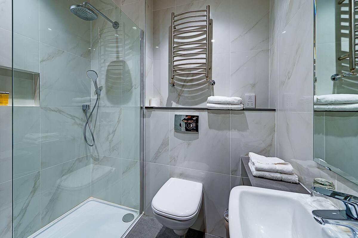 eco-friendly toiletries, hair dryer, towels, soap