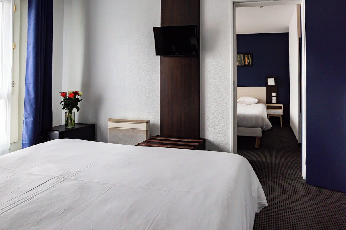 Family Room | Premium bedding, desk, laptop workspace, soundproofing