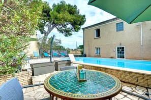 Seasonal outdoor pool, open 9:00 AM to 8:00 PM, sun loungers
