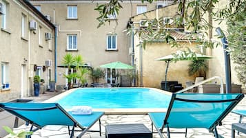 Seasonal outdoor pool, open 9:00 AM to 8:00 PM, sun loungers