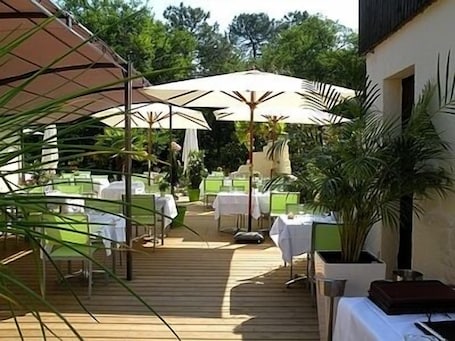 Lunch, dinner served; French cuisine, pool views