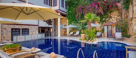 Seasonal outdoor pool, pool umbrellas, sun loungers