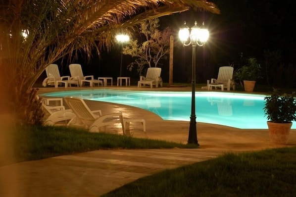Outdoor pool, open 9 AM to 9 PM, pool umbrellas, pool loungers