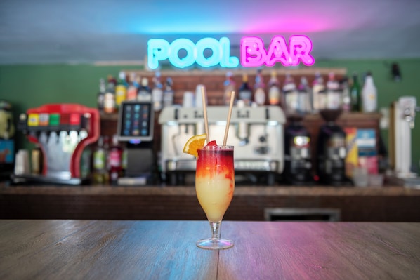 A bar with a neon sign reading "POOL BAR" and a cocktail on the counter. - Hotel Parasol by Dorobe (Torremolinos)