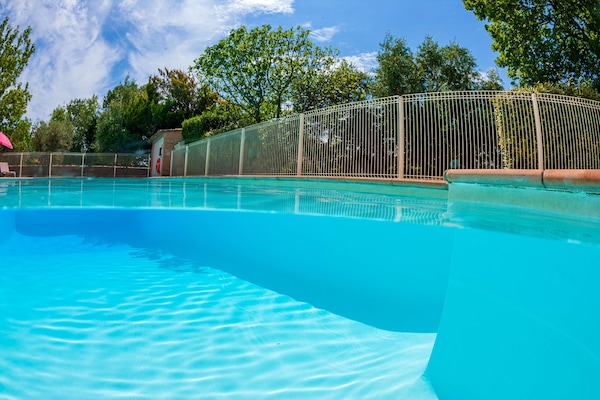 Seasonal outdoor pool, pool umbrellas, pool loungers