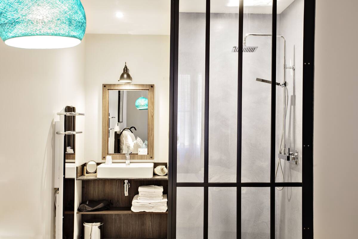 premium room | bathroom | designer toiletries, hair dryer, bathrobes, slippers