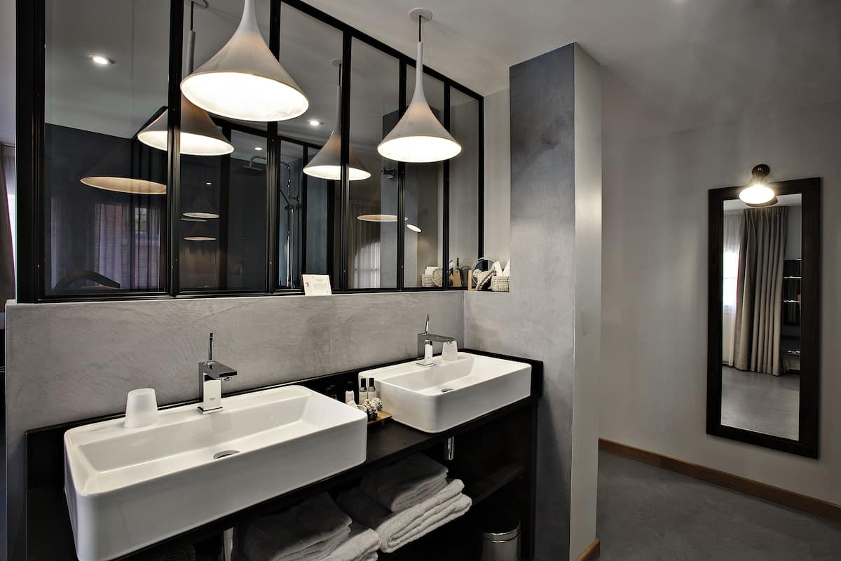 deluxe room | bathroom | designer toiletries, hair dryer, bathrobes, slippers