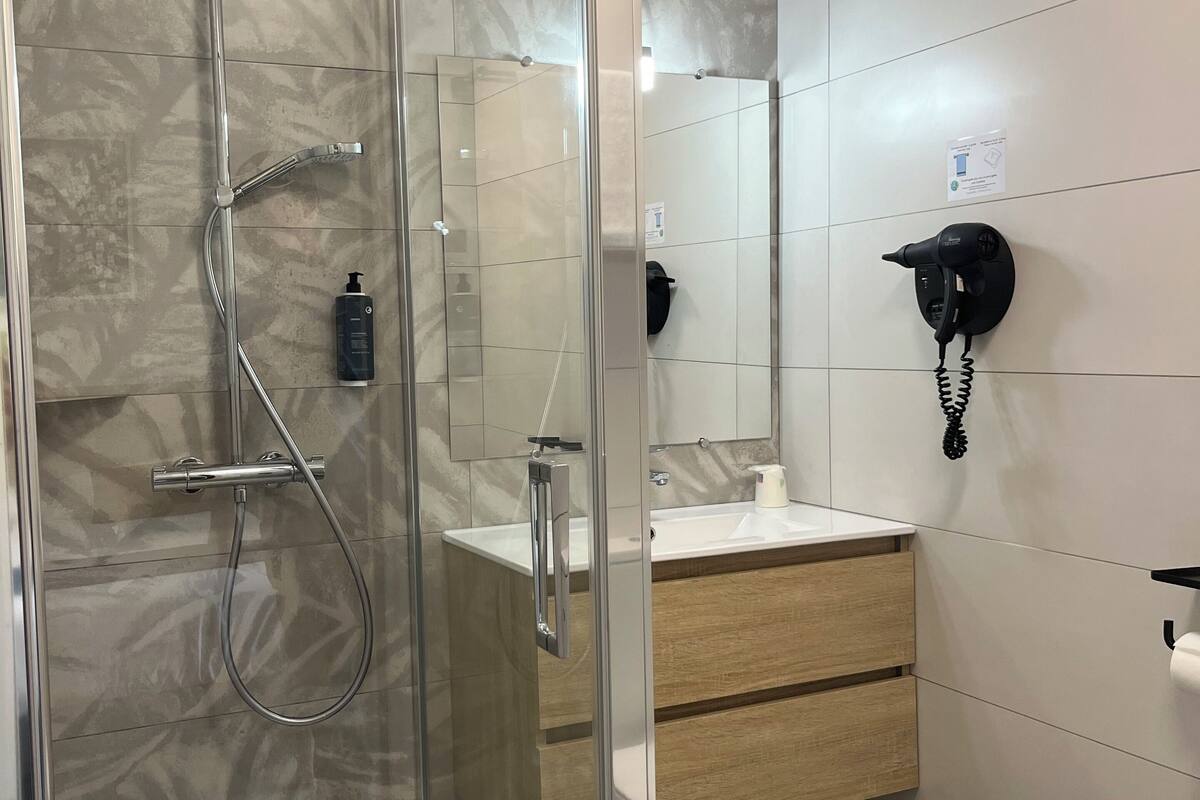 family room | bathroom | shower, free toiletries, hair dryer, towels