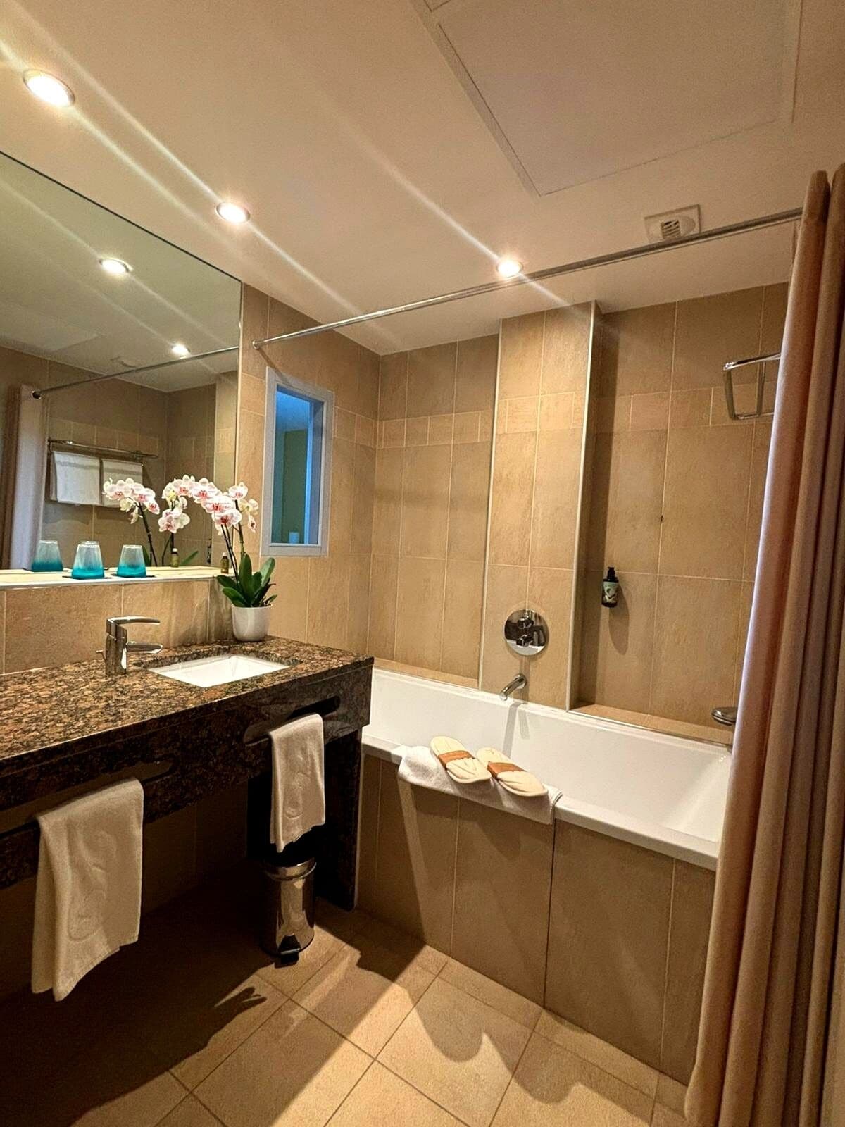 hair dryer, slippers, towels