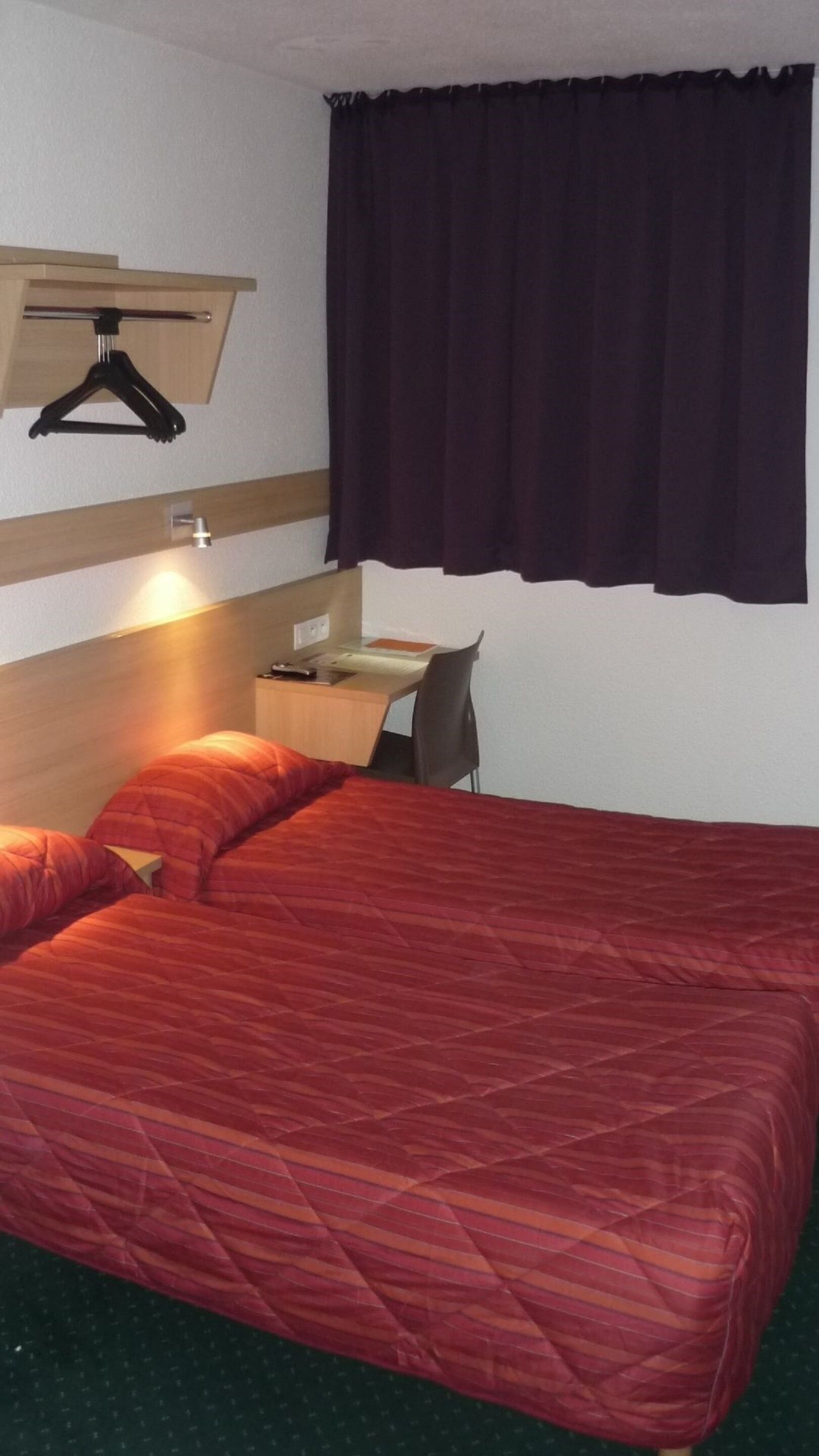 Desk, blackout drapes, free WiFi, bed sheets