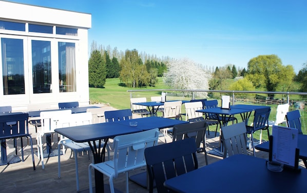 Breakfast, lunch, dinner served; golf course views