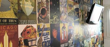 A wall covered with vintage travel posters.