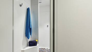 Shower, rainfall showerhead, eco-friendly toiletries, towels