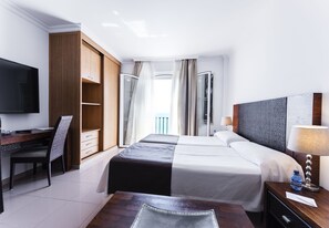 Studio, Sea View | Down comforters, in-room safe, desk, laptop workspace