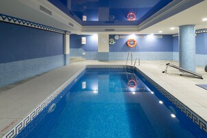 Indoor pool, outdoor pool, open 10 AM to 7 PM, pool umbrellas
