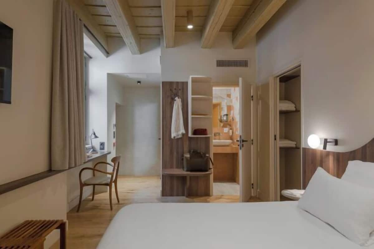 Premium bedding, pillowtop beds, desk, laptop workspace
