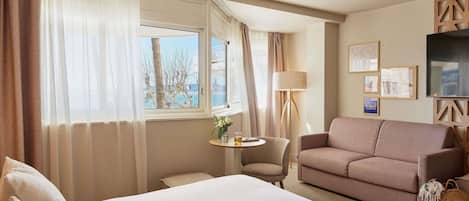 Suite junior, 1 cama doble, vistas al mar | Ropa de cama de alta calidad, caja fuerte, escritorio