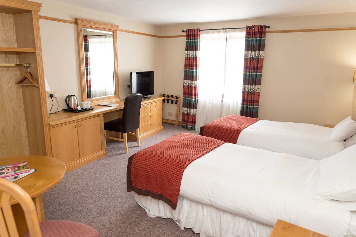Premium bedding, desk, laptop workspace, iron/ironing board (on request)