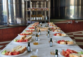 A buffet table with various food items and condiments.