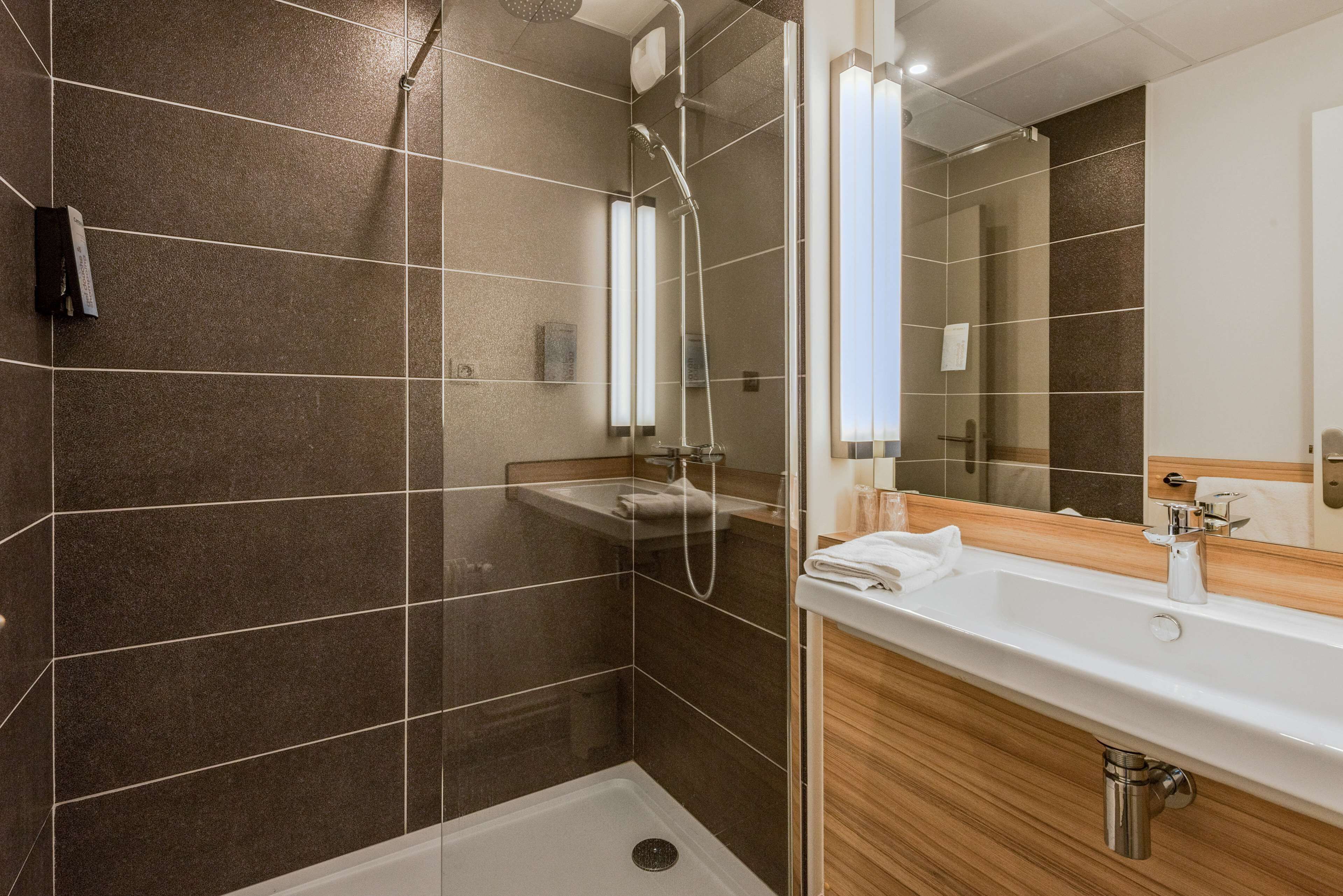 shower, eco-friendly toiletries, hair dryer, towels