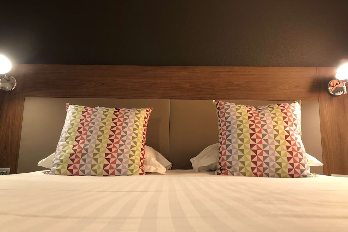 premium bedding, desk, laptop workspace, blackout curtains