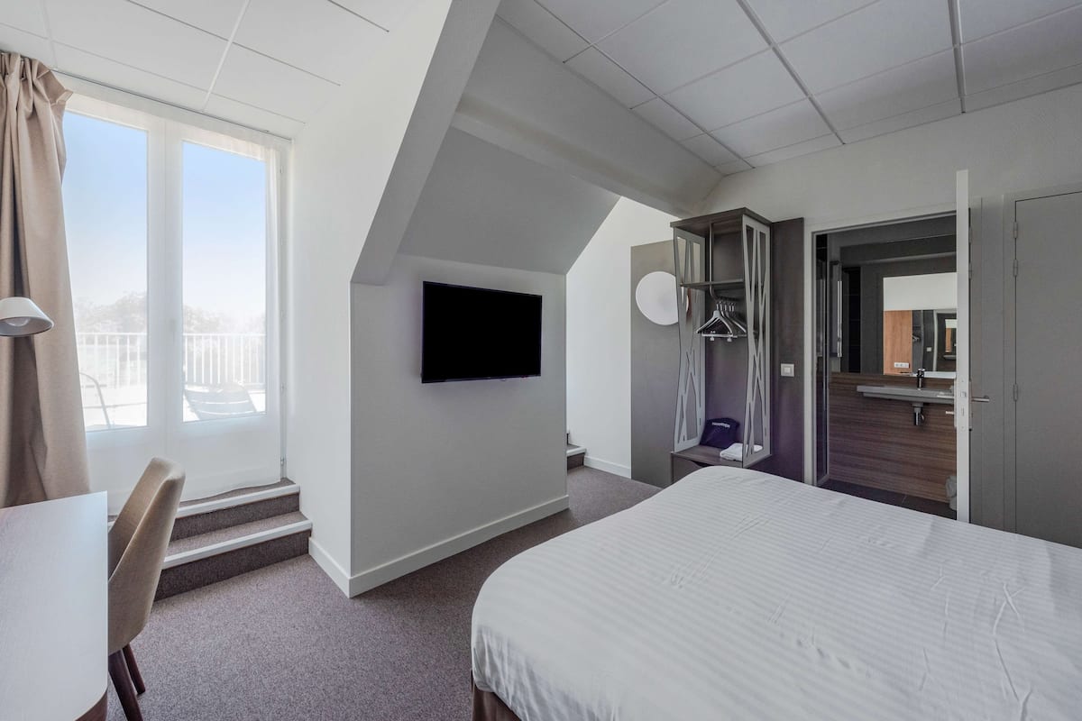 premium bedding, desk, laptop workspace, blackout curtains