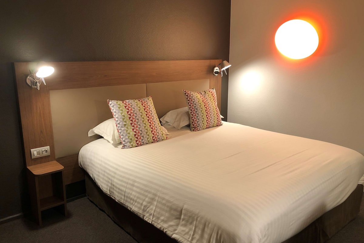 premium bedding, desk, laptop workspace, blackout curtains