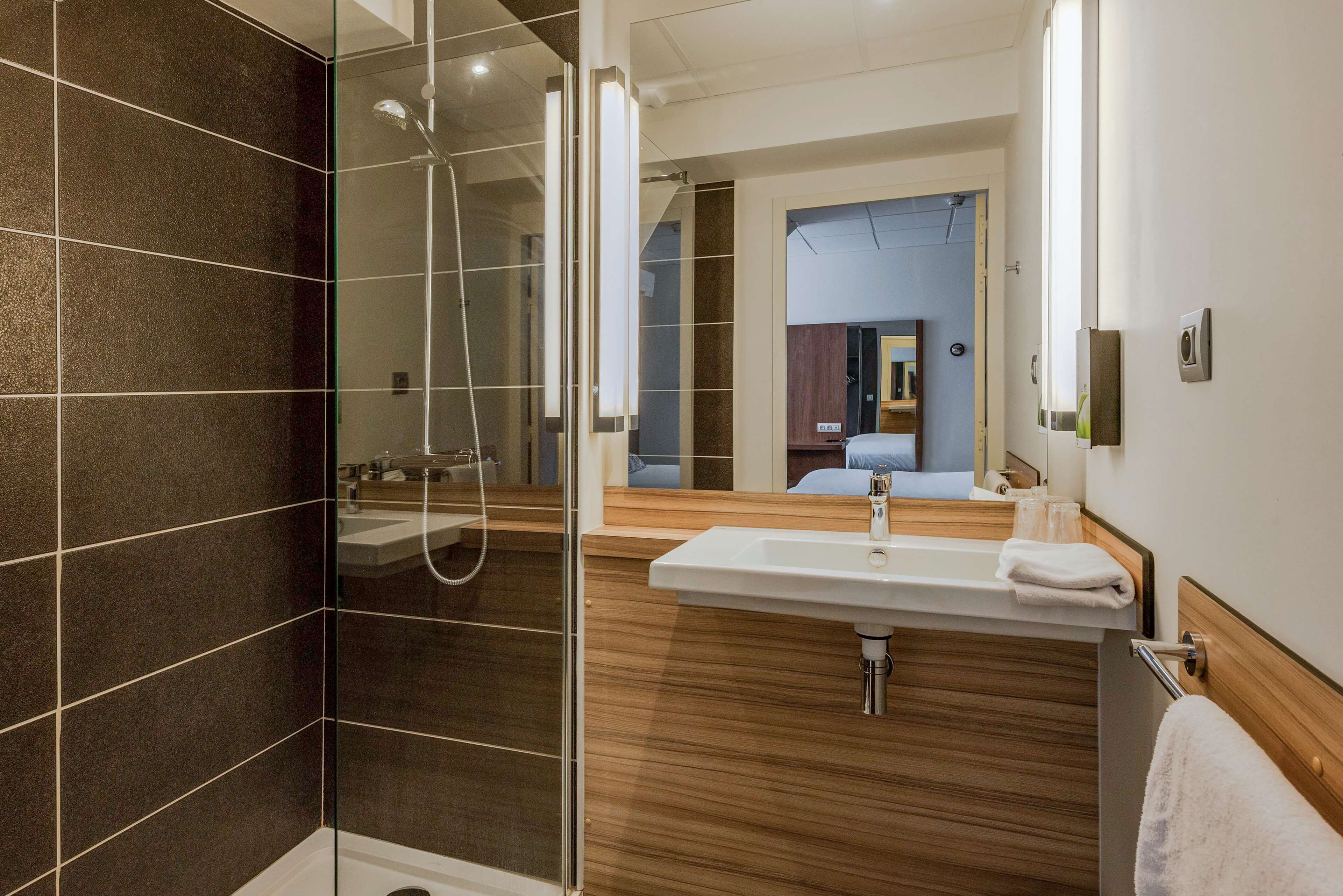 shower, eco-friendly toiletries, hair dryer, towels