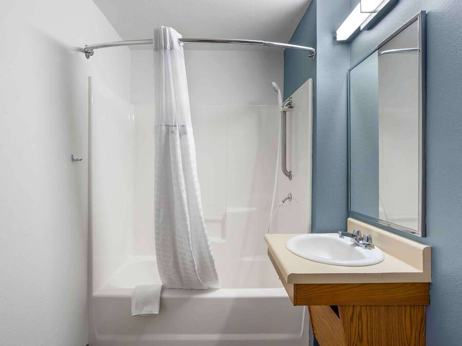 Combined shower/bathtub, towels, soap, toilet paper