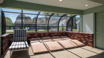 Indoor pool, seasonal outdoor pool, pool umbrellas, pool loungers