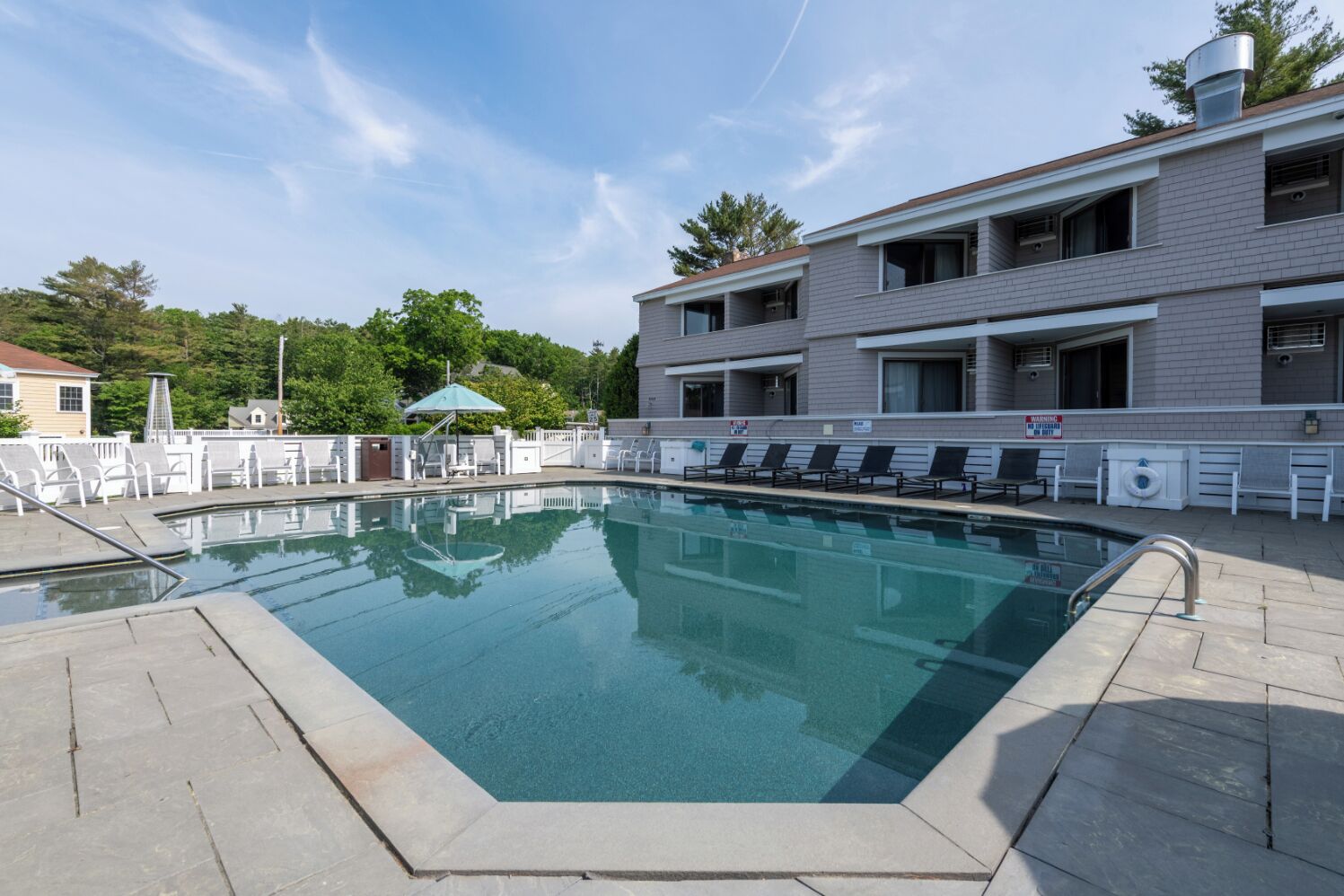 Indoor pool, seasonal outdoor pool, pool umbrellas, pool loungers