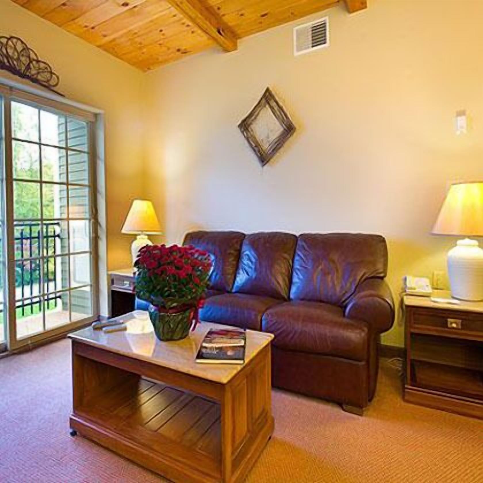 suite, multiple beds | living room | 27-inch tv with cable channels, fireplace, dvd player