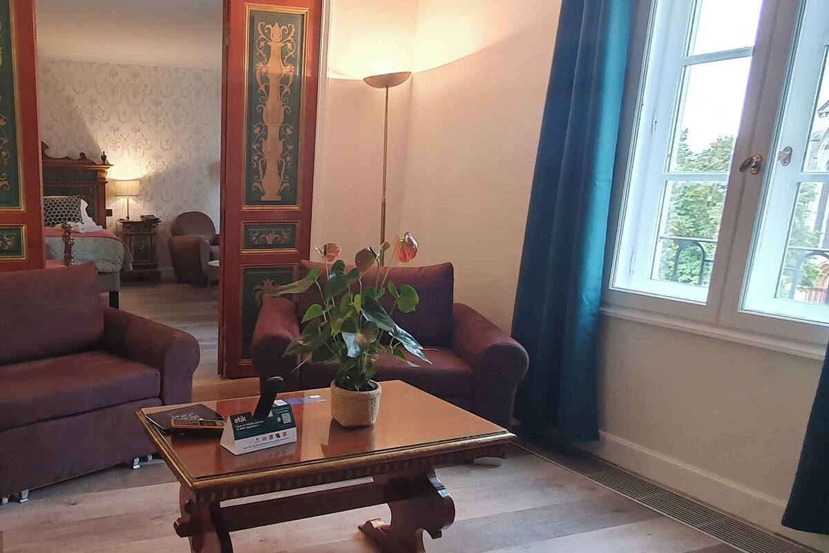 junior suite, multiple beds | living area | 82-cm tv with cable channels