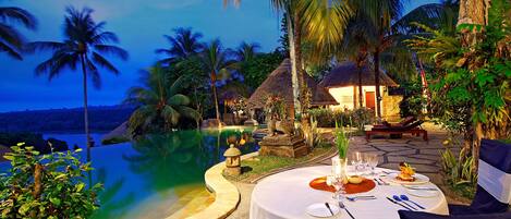 Outdoor pool, an infinity pool, free pool cabanas, pool umbrellas