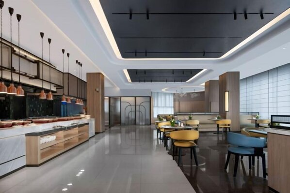 A modern kitchen with a central island, pendant lighting, and a dining area with tables and chairs.