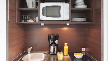 Fridge, microwave, electric kettle, high chair