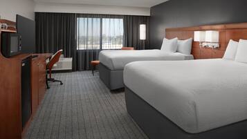 Premium bedding, desk, laptop workspace, iron/ironing board