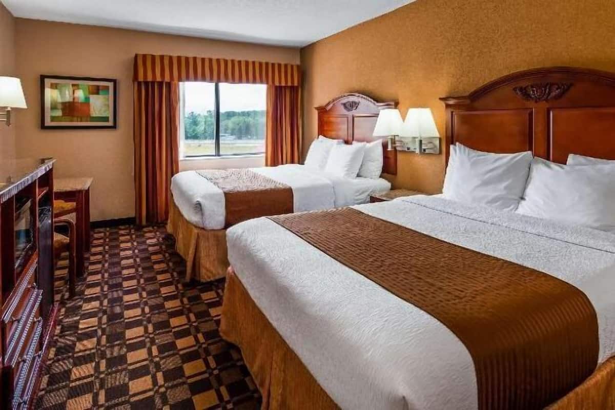 Premium bedding, pillow-top beds, laptop workspace, blackout curtains