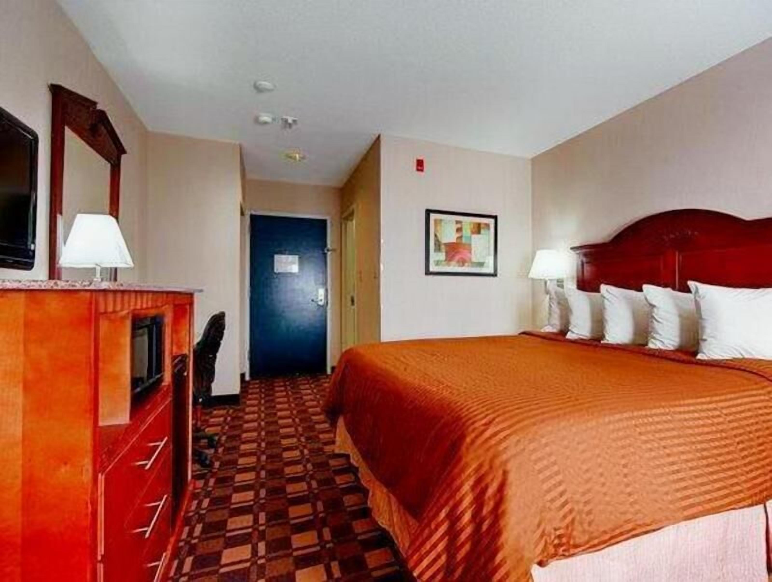 Premium bedding, pillowtop beds, laptop workspace, blackout drapes