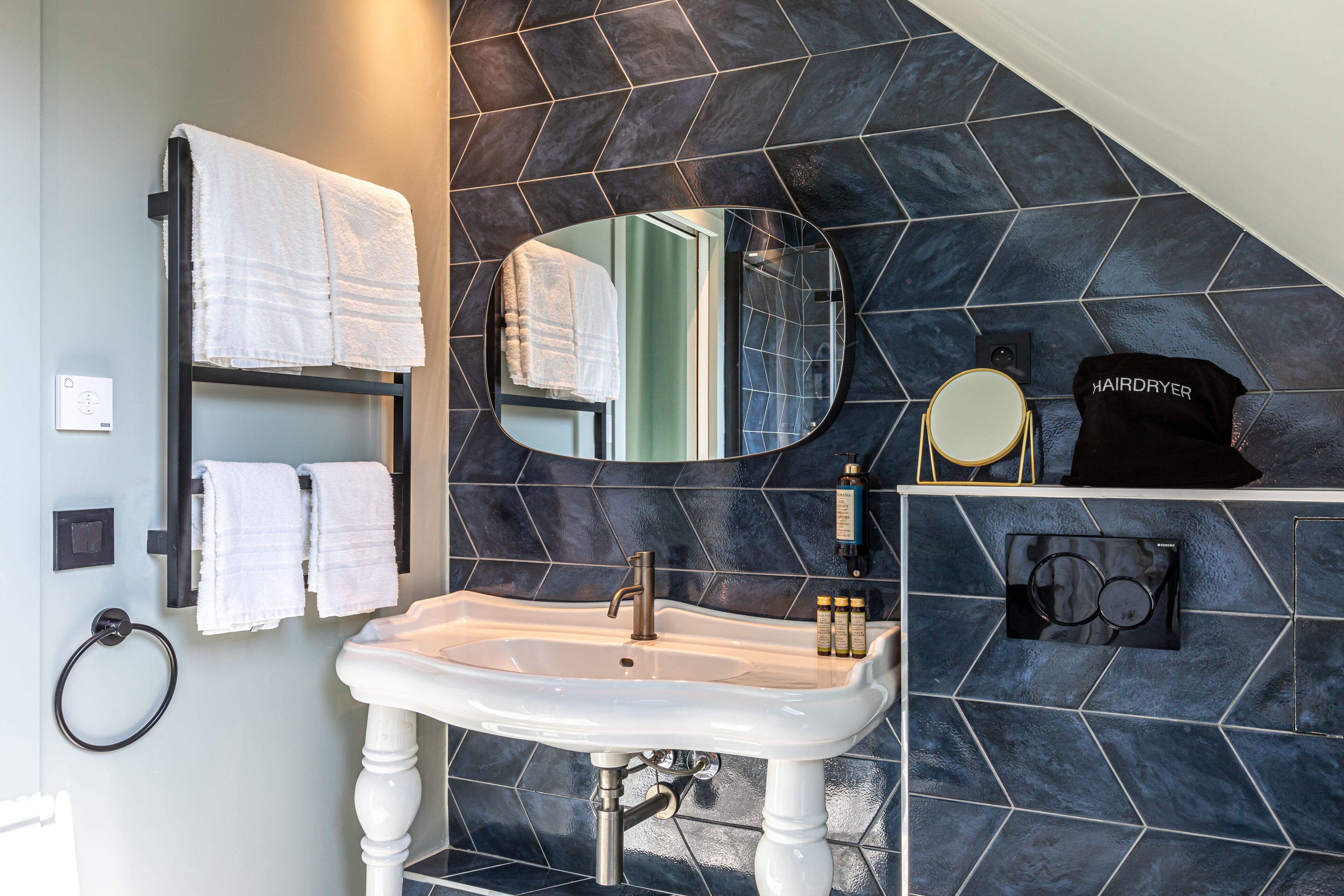 deluxe room, 1 king bed | bathroom | free toiletries, hair dryer, slippers, towels