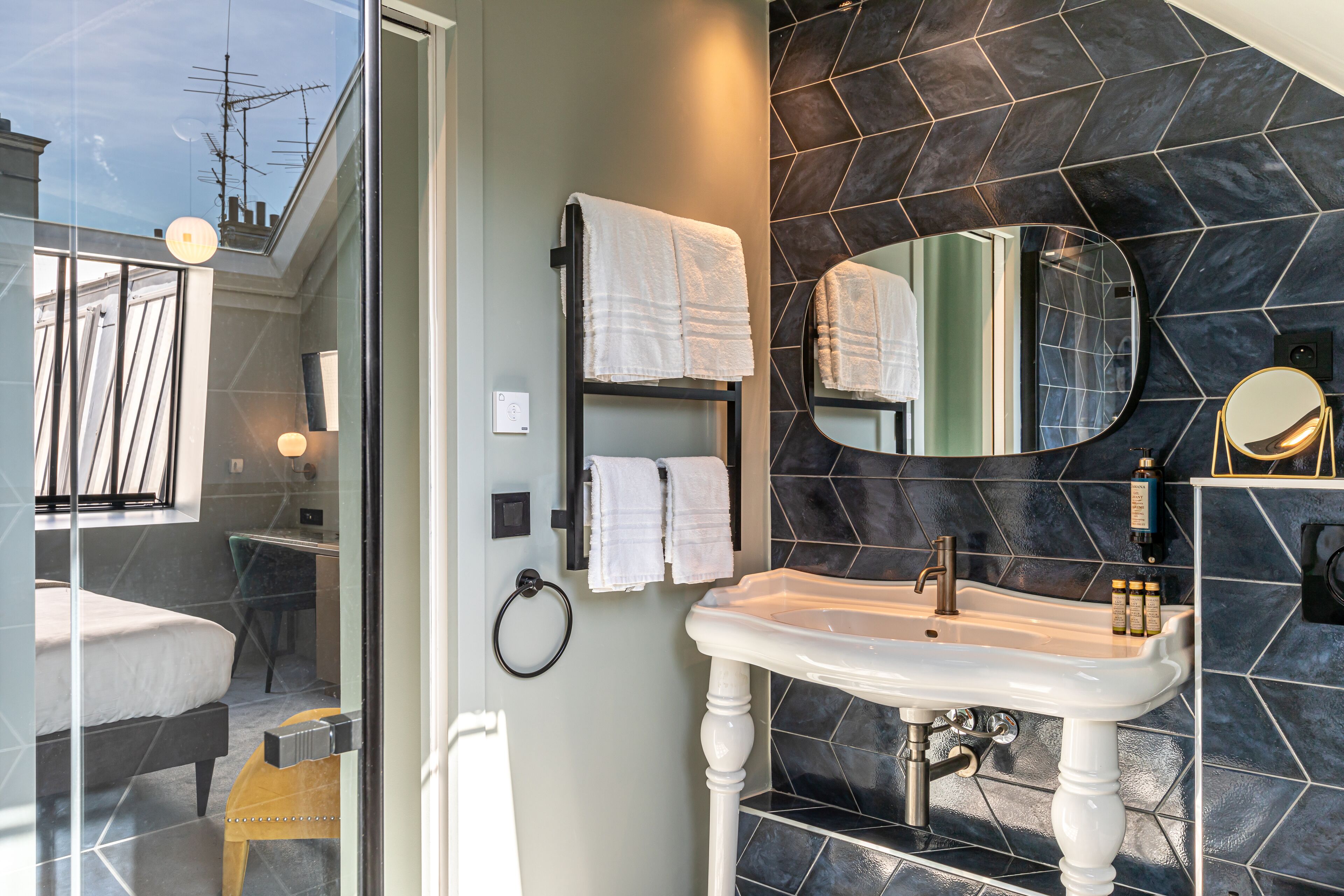 deluxe room, 1 king bed | bathroom | free toiletries, hair dryer, slippers, towels