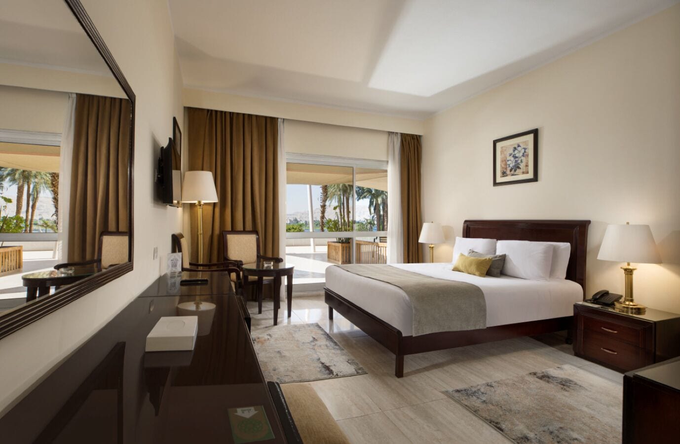 Deluxe Room, River View | In-room safe, desk, bed sheets