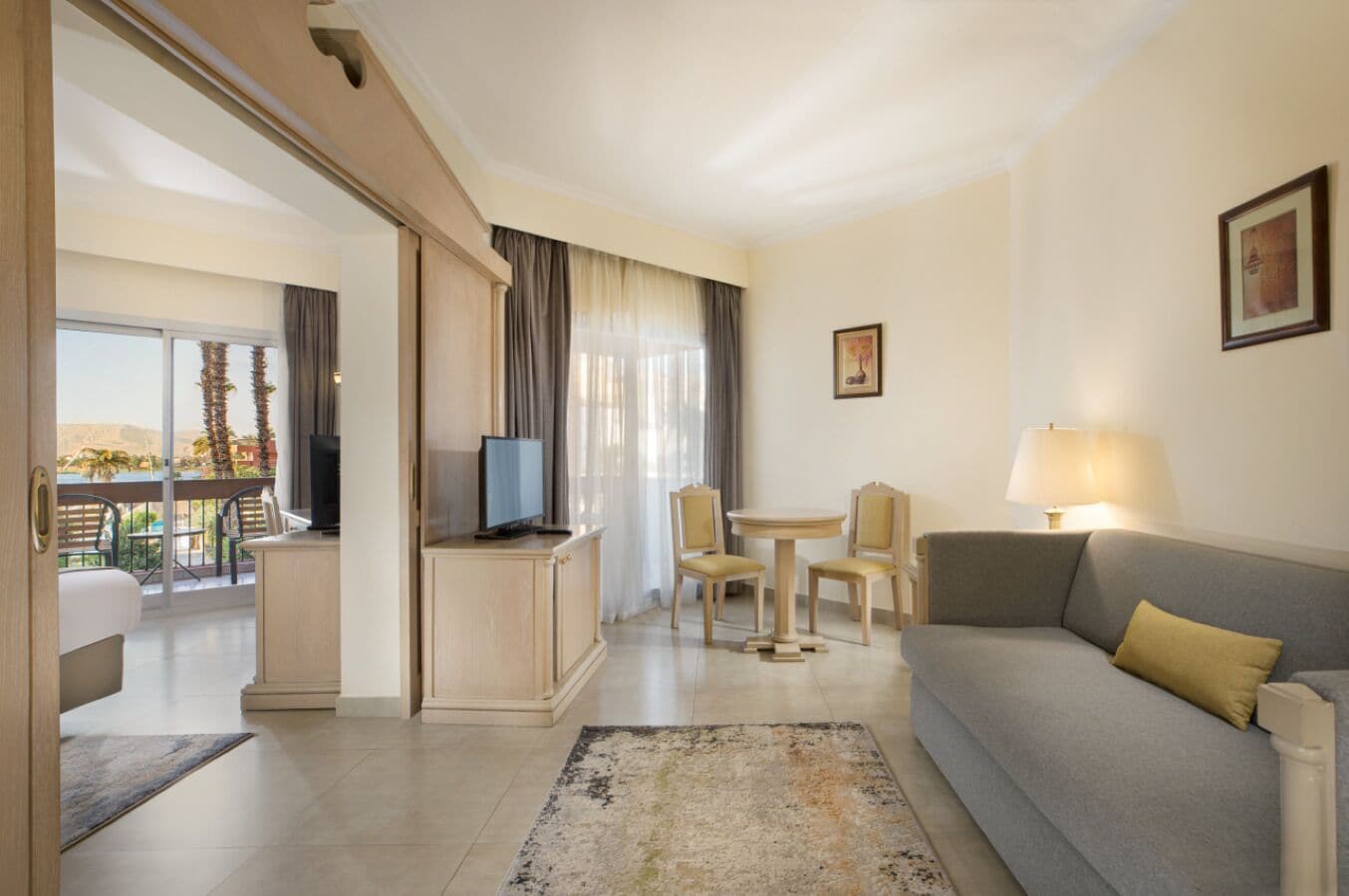 Junior Suite, Nile View | In-room safe, desk, bed sheets