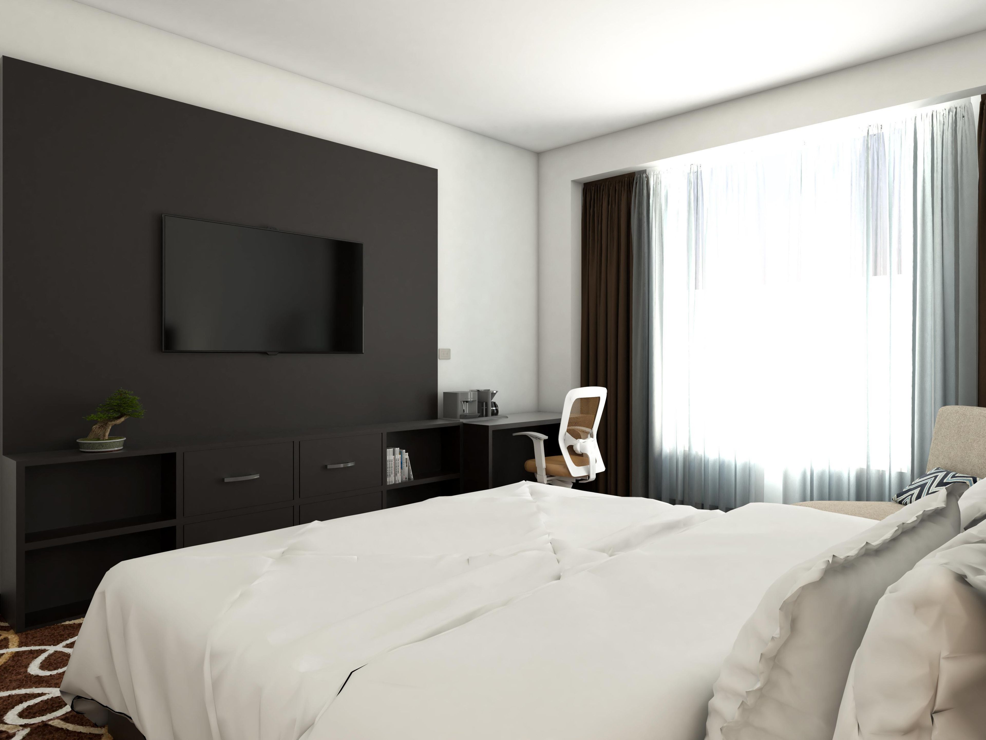 A modern hotel room with a large bed, a flat-screen TV mounted on the wall, a desk with a chair, and a window with curtains.