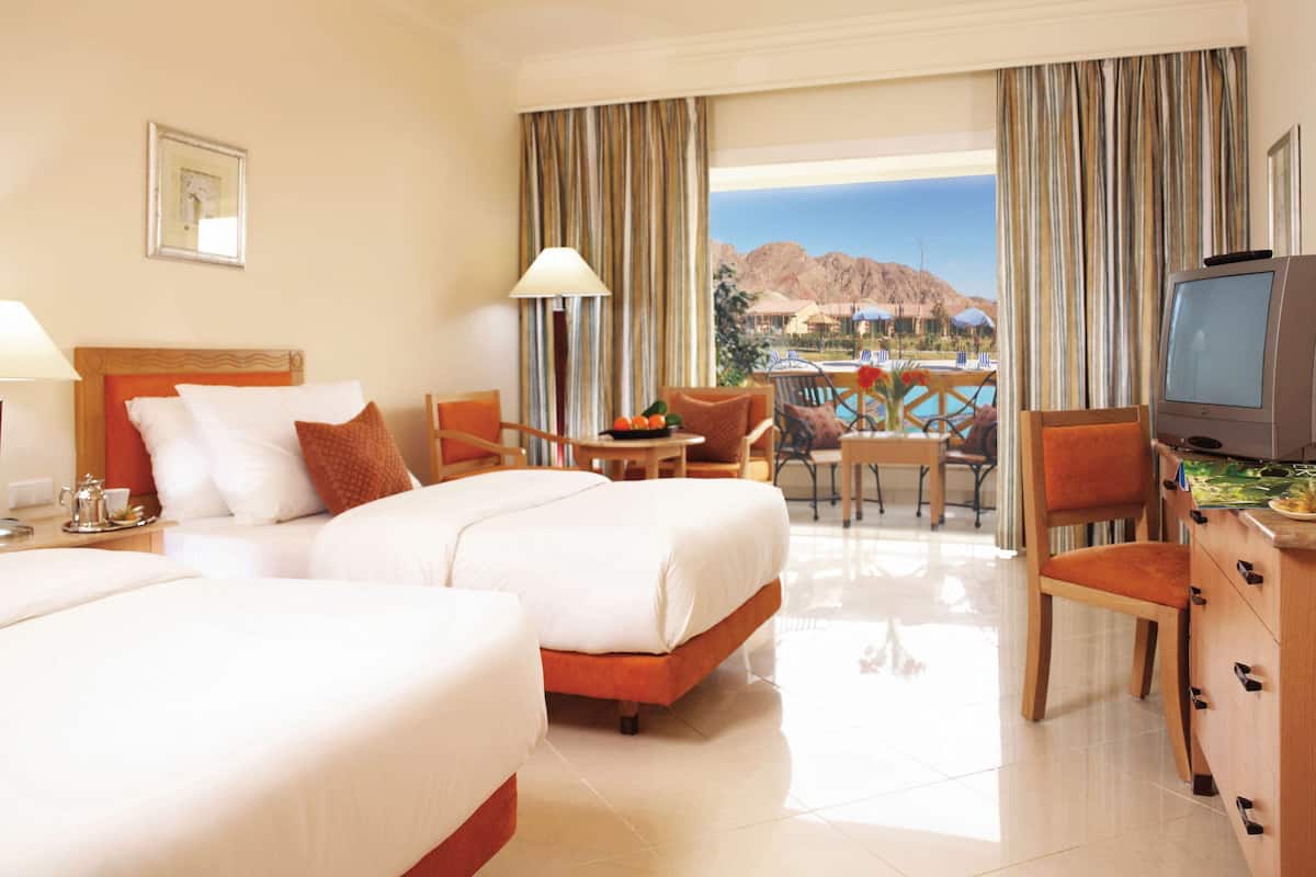 classic twin room, 2 single beds, pool view | 1 bedroom, in-room safe, soundproofing, iron/ironing board