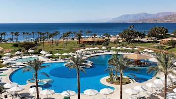 Indoor pool, outdoor pool, open 9:00 AM to 6:00 PM, pool umbrellas