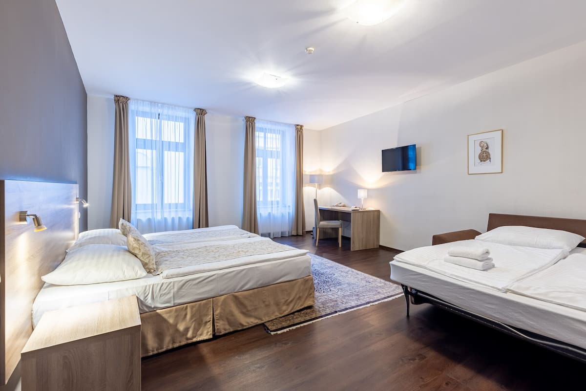 family suite | 1 bedroom, minibar, in-room safe, desk