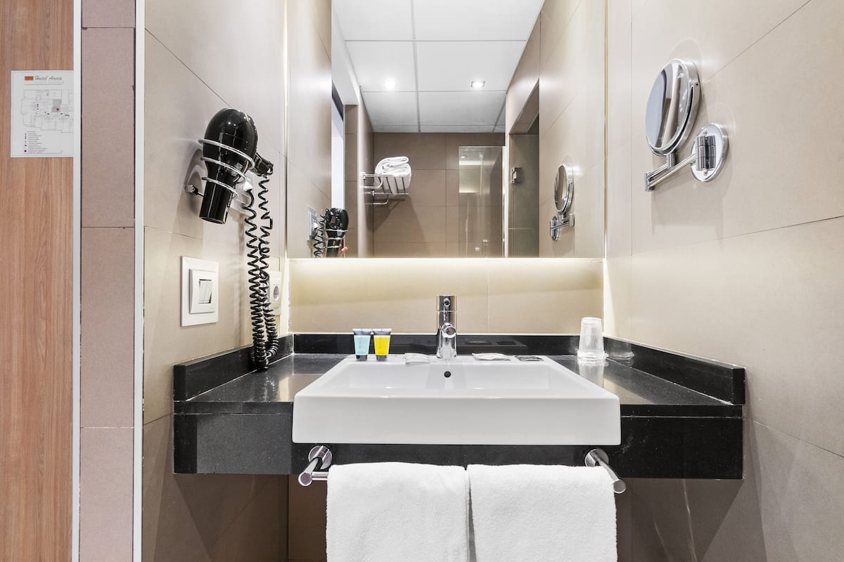 designer toiletries, hair dryer, bathrobes, towels