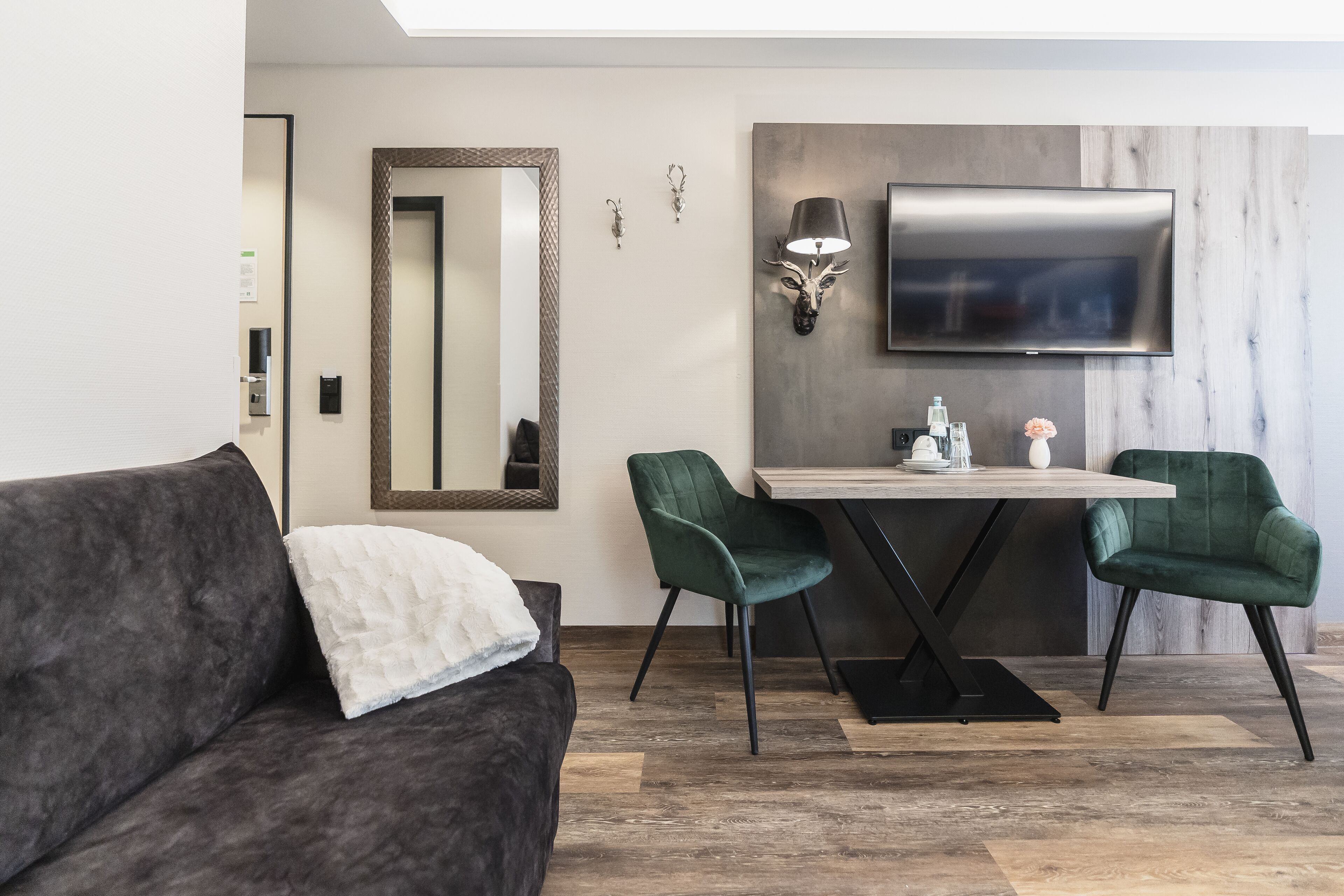 premium quadruple room | living area | flat-screen tv